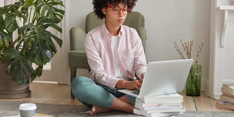 black-businesswoman-keyboards-on-laptop-computer-RXTPFFR.jpg